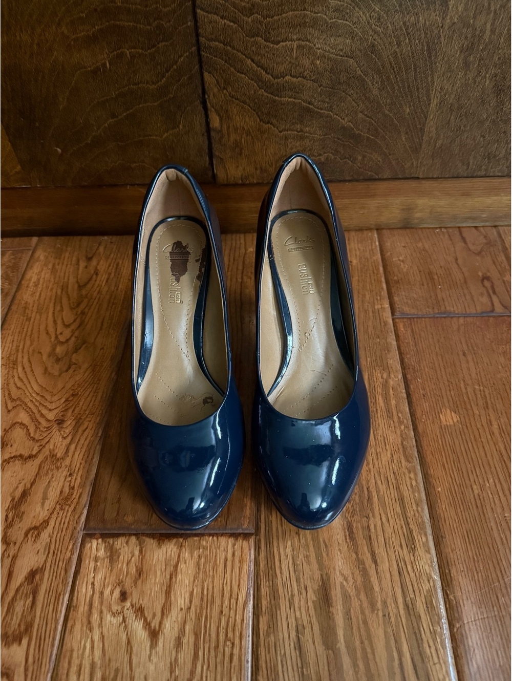 Clarkโs navy patent leather pumps